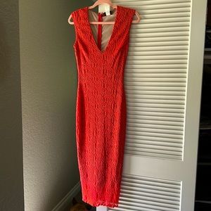 New cocktail dress with tags. Lace material in a bright coral color. HMS size M